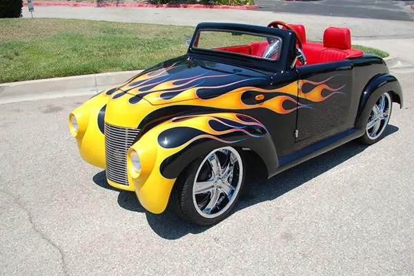 Black 39 Roadster with Yellow Flames affordable golf cart rental, golf cart rent isle of palms golf cart rental