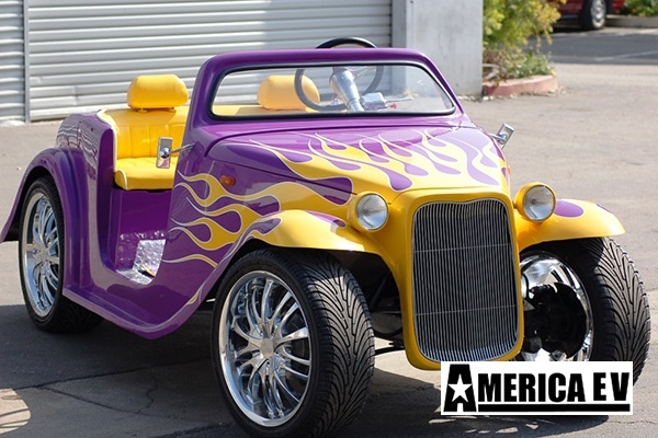 Purple California Roadster with Yellow Flames affordable golf cart rental, golf cart rent isle of palms golf cart rental
