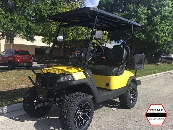 Yellow Aluma 4 Passenger Lifted Golf Cart affordable golf cart rental, golf cart rent isle of palms golf cart rental